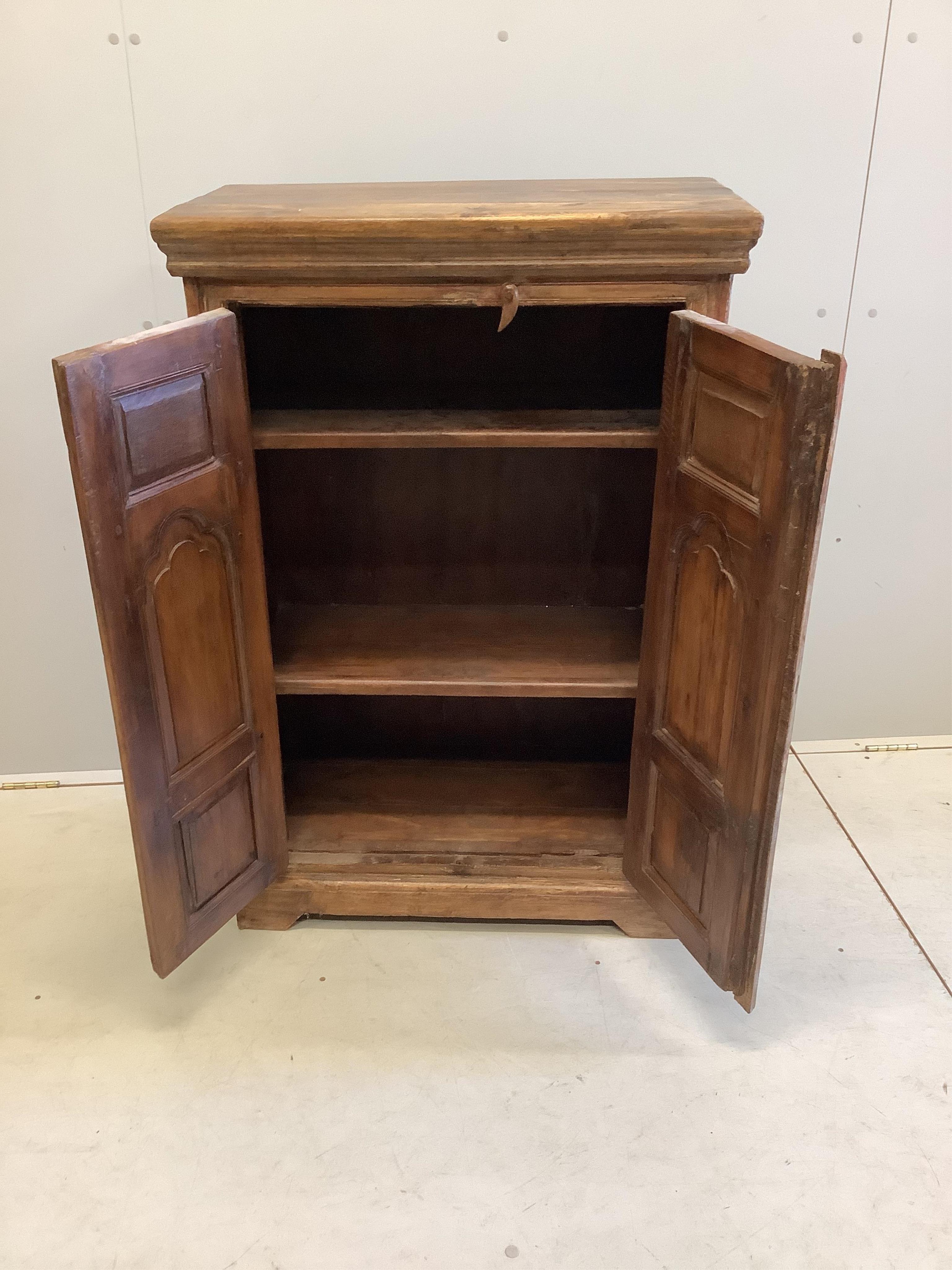 An Indonesian carved hardwood two door side cabinet, width 74cm, depth 39cm, height 112cm